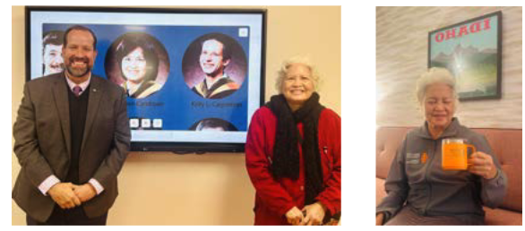 Cam Hoan Nguyen in Leonard Hall in front of her graduating class photo
